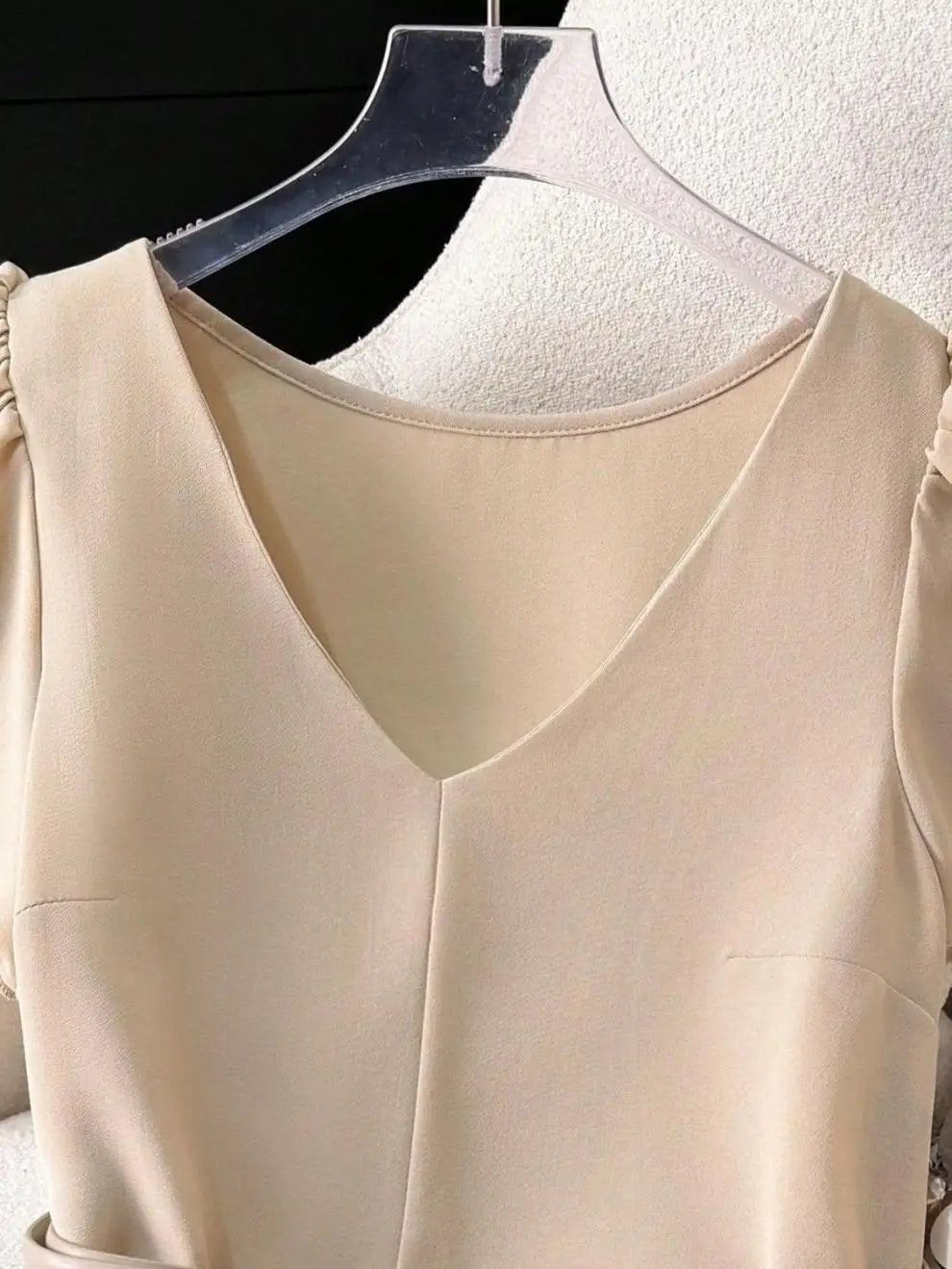 Women's Light Beige Lotus leaf sleeves Top with Deep V-Neck and Shoulder Ruffles Paired with a Light Gray Belt and Gold Buckle